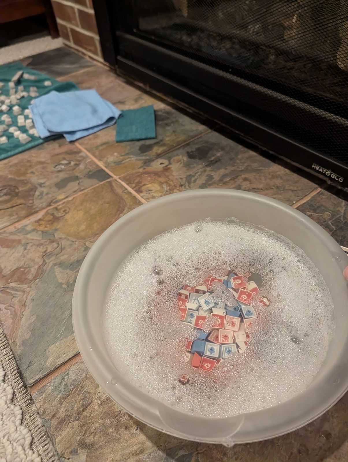 Keyboard keycaps in a cleaning bath at the Keyboard Spa workbench